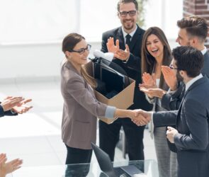 a manager conducts job orientation for several new employees.