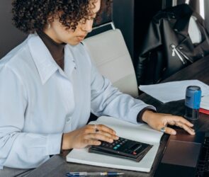 Free An Accountant Using a Calculator Stock Photo