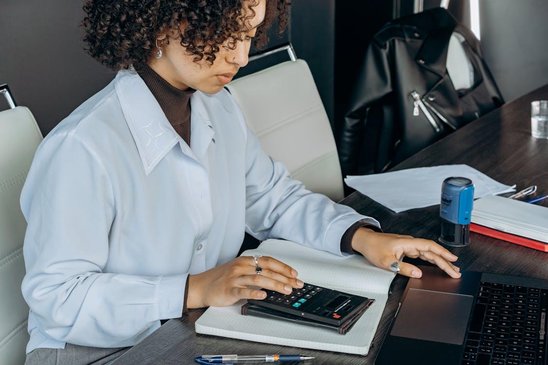 Free An Accountant Using a Calculator Stock Photo